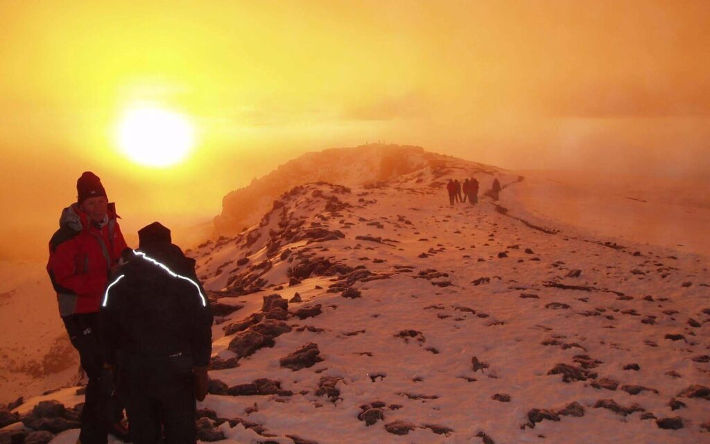 Group of trekkers hiking Kilimanjaro mountain-Mado Tours Africa